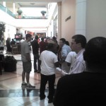 A crowd lined up in a shopping mall on iPhone launch day